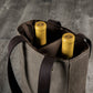 Beige insulated wine tote with dark brown handles holding two bottles of yellow-labeled wine