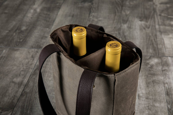 Beige insulated wine tote with dark brown handles holding two bottles of yellow-labeled wine
