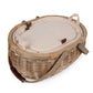 Beige wicker picnic basket with cream insulated lining and brown leather handles, lid open