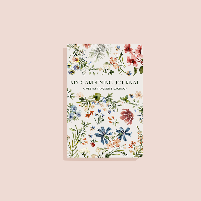 My Gardening Journal with cream cover featuring botanical watercolor flowers in red, blue, orange, and green illustration