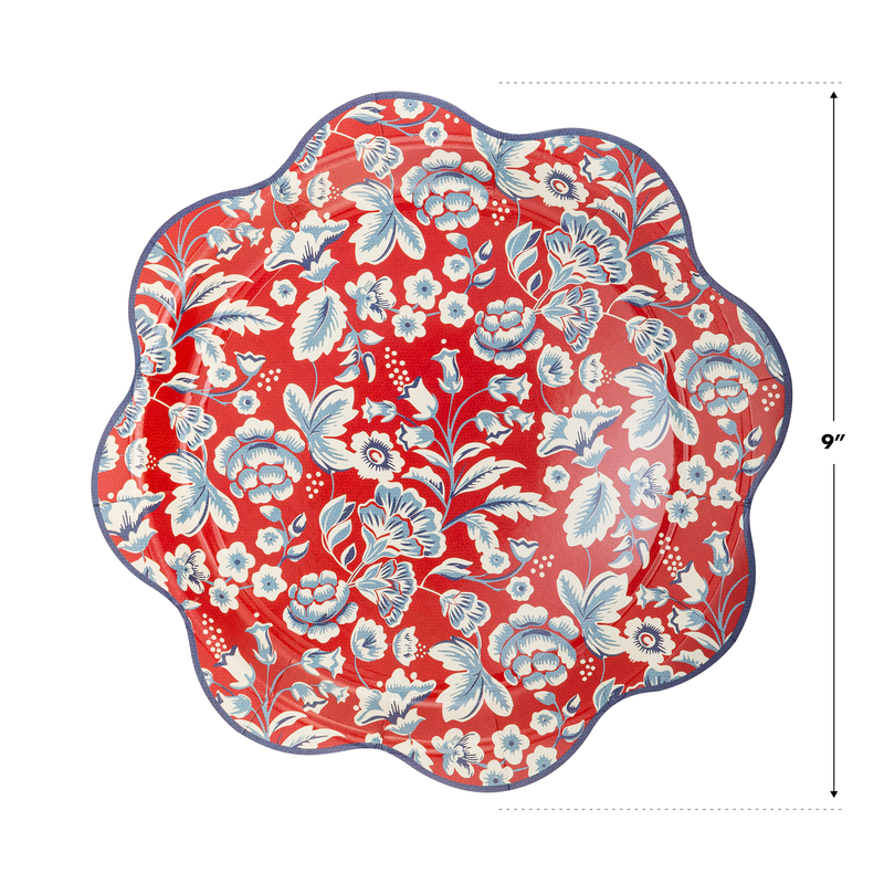 Rust-red paper plate with scalloped wavy edge, white and blue floral botanical pattern, 9 inches