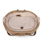 Handwoven wicker picnic basket interior with cream fabric lining, brown leather accents, tan woven handles, and classic English-style details.