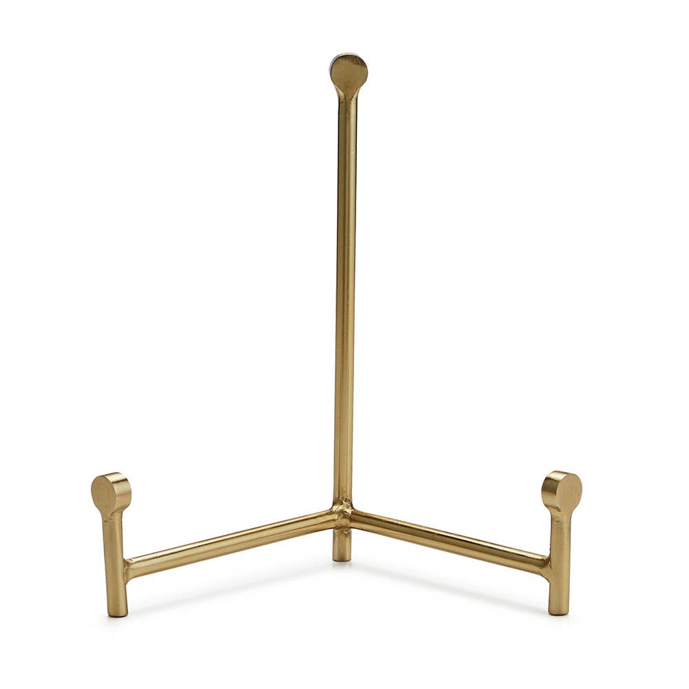 Gold metal easel with tall central post, three-legged tripod base, and decorative round finial