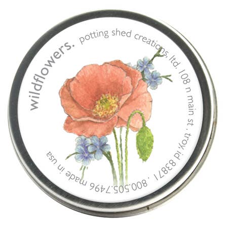 Circular seed packet with watercolor illustration of coral poppies, yellow centers, green pods, and blue forget-me-nots on white background