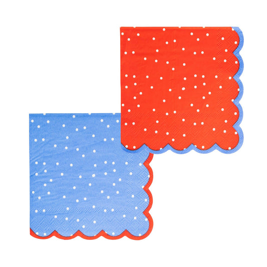 Red and blue paper cocktail napkins with white polka dots and scalloped edges, 4th of July themed party supplies.
