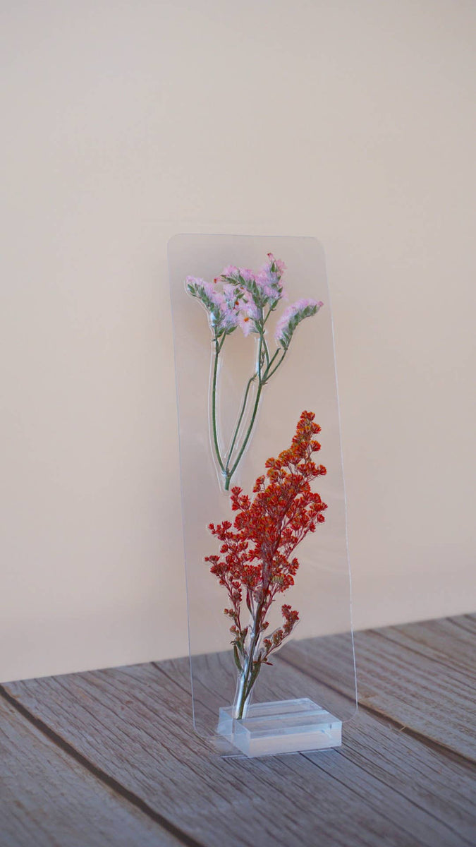 Transparent acrylic bookmark with pressed lavender flowers and red baby's breath preserved inside