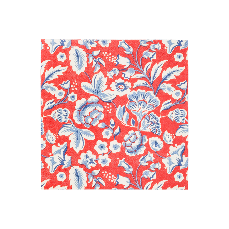 Red cocktail napkin with white and blue floral pattern featuring stylized flowers, leaves, and botanical details throughout the design