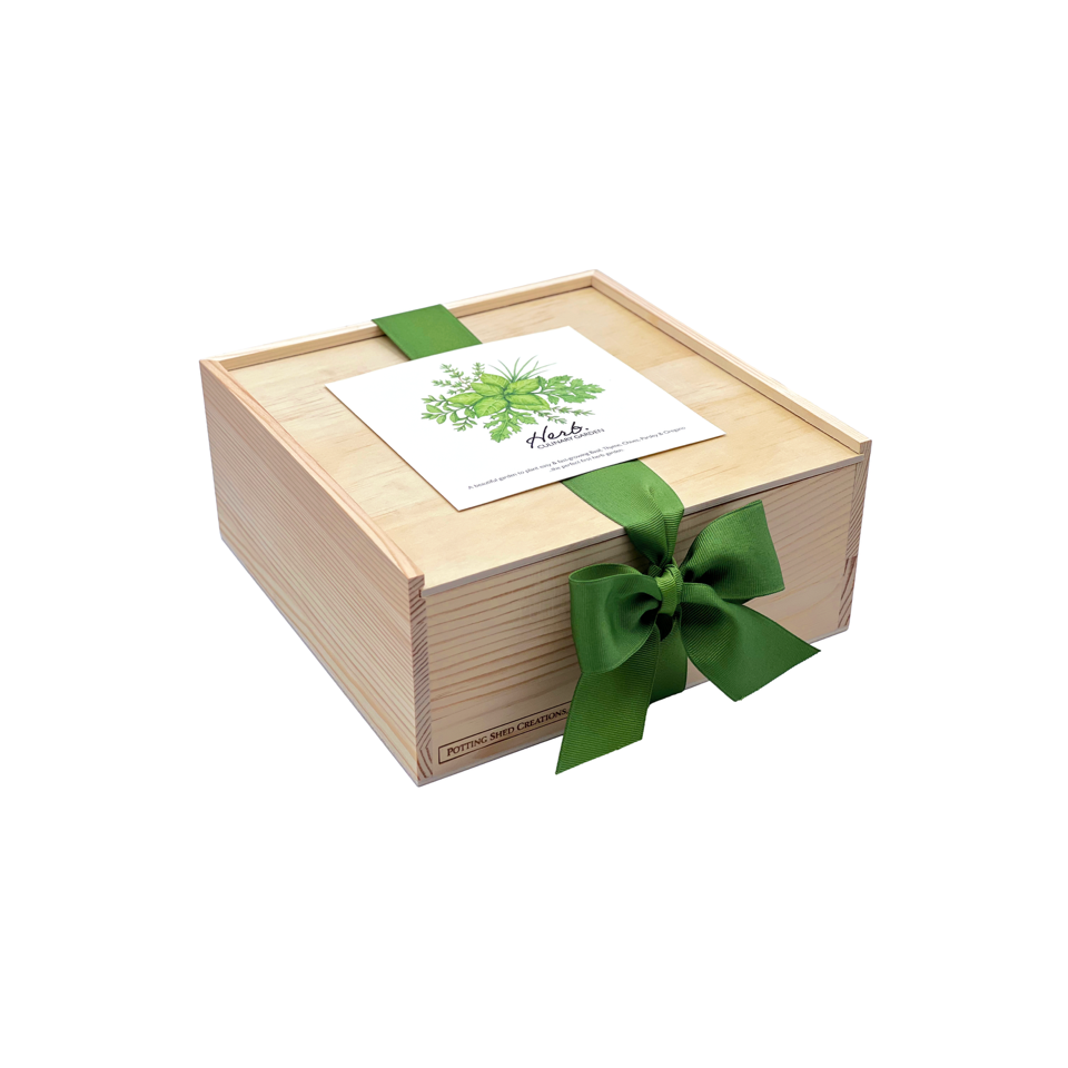 Wooden garden box with hinged lid, white herb seed card, and green ribbon bow