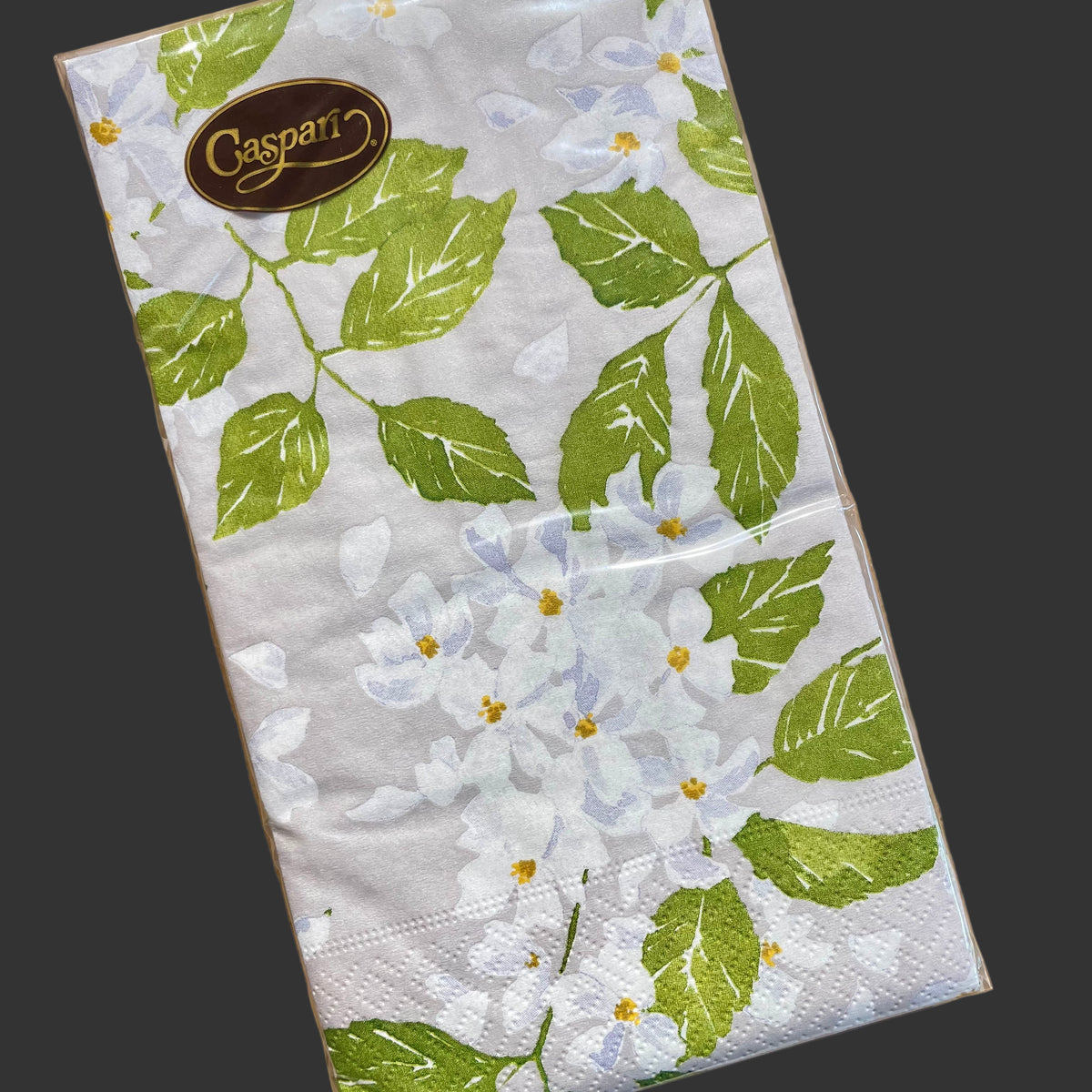 Caspari guest towels with white and lavender flowers, green leaf botanical pattern on white triple-ply paper napkins