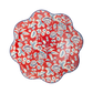 Red paper plate with white and blue floral botanical Americana print and scalloped wave edge