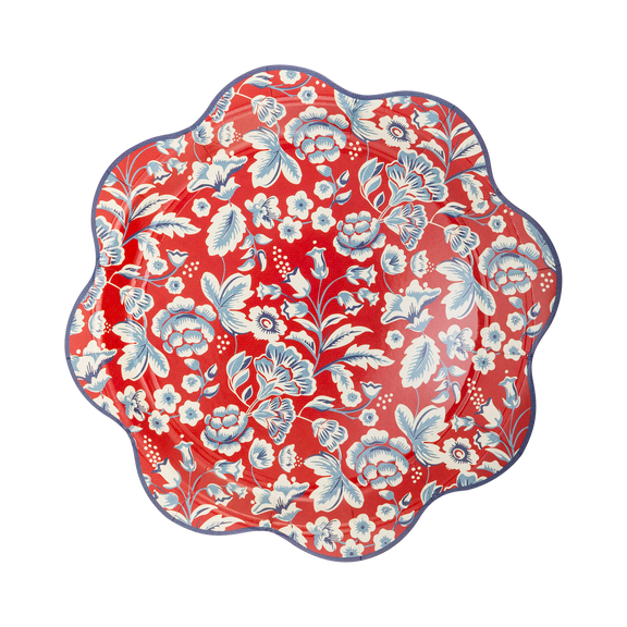 Red paper plate with white and blue floral botanical Americana print and scalloped wave edge