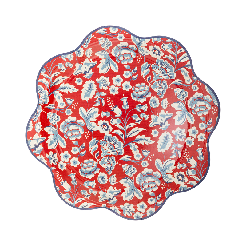 Red paper plate with white and blue floral botanical Americana print and scalloped wave edge