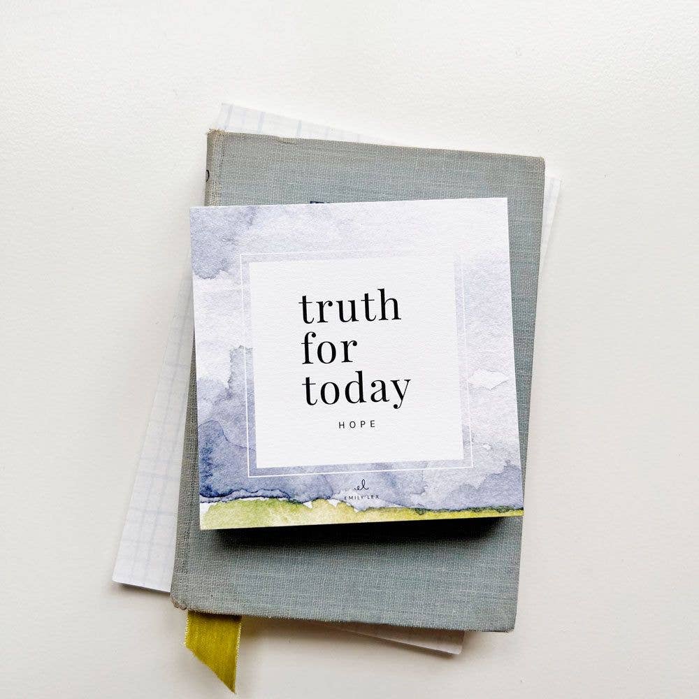 Stack of scripture prayer cards with "Truth for Today Hope" displayed on top card featuring blue and yellow watercolor design, layered on gray fabric with yellow ribbon
