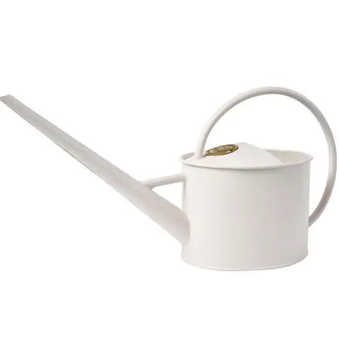Buttermilk-colored watering can with cylindrical body, curved handle, and long angled spout