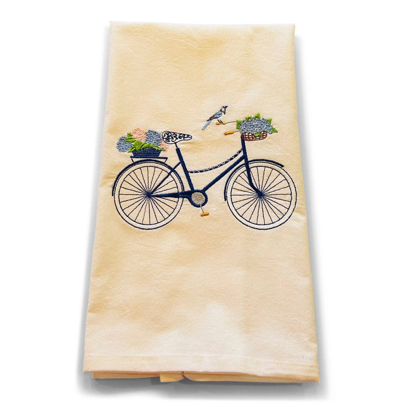 Navy bicycle with blue and green potted succulents embroidered on cream-colored cotton flour sack dish towel with bird accent
