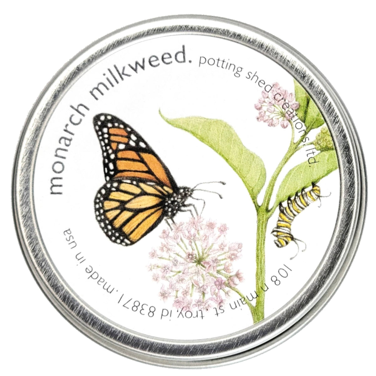 Circular seed packet with monarch butterfly, milkweed plant with pink flowers and green leaves, caterpillars on stems, and metallic silver border