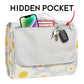White polyester toiletry bag with yellow daisy print, gray front panel with hidden pocket feature, Carstens branding