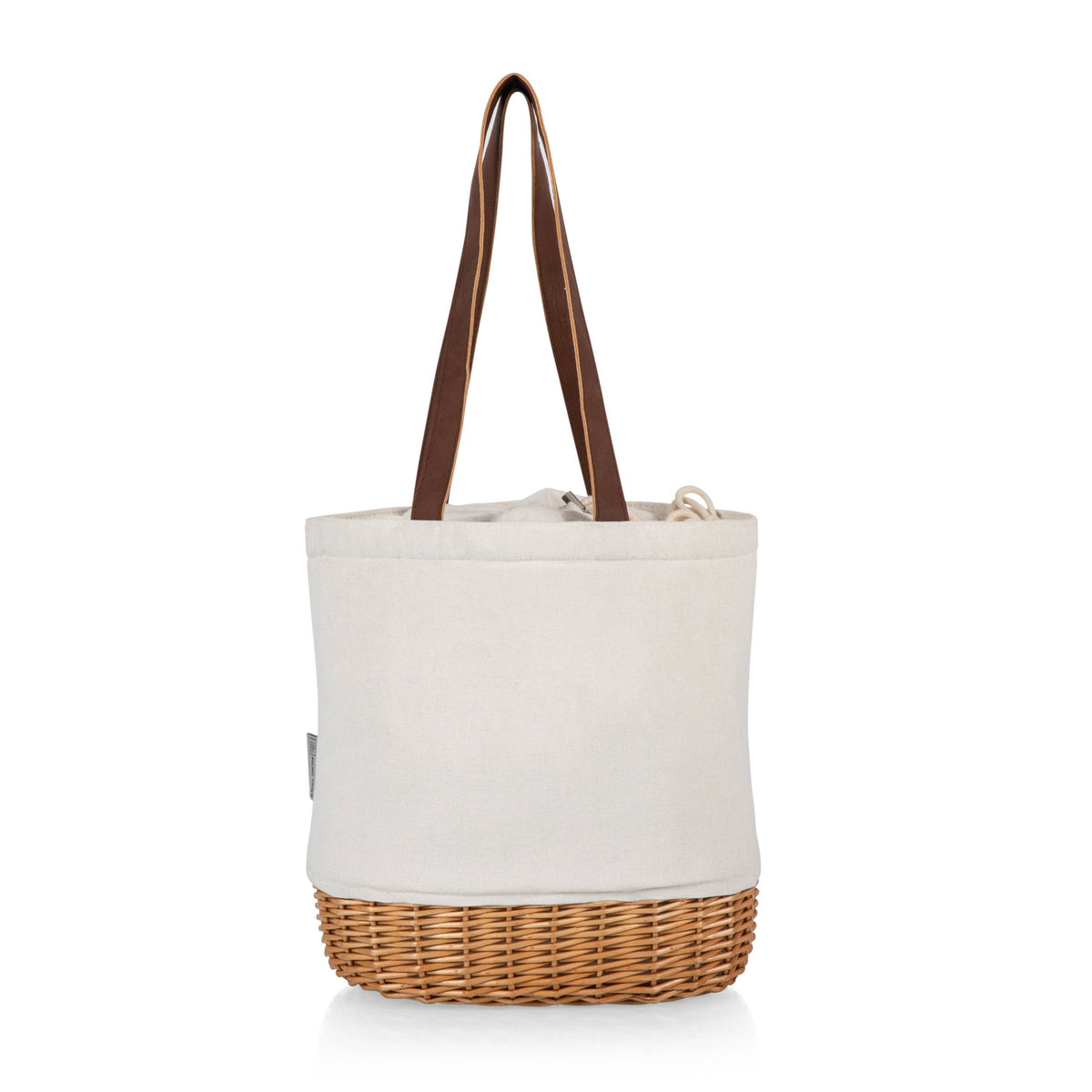 Cream canvas tote with tan wicker base and brown leather handles