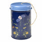 Navy tin with blue lid and botanical floral illustration, jute twine handle coiled on top