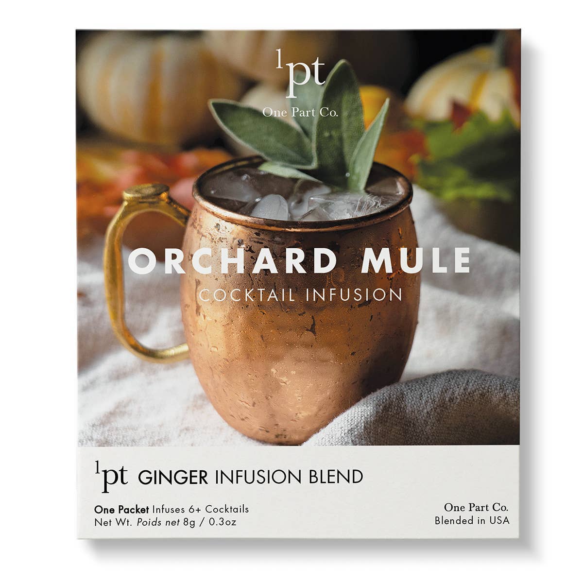 Copper mule mug filled with dark cocktail and ice, topped with fresh sage leaf garnish, One Part Co. Orchard Mule infusion