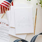 Stack of unpainted notecards with ice cream truck illustration outline, American flags, paintbrush, and instructions in patriotic red, white and blue styling