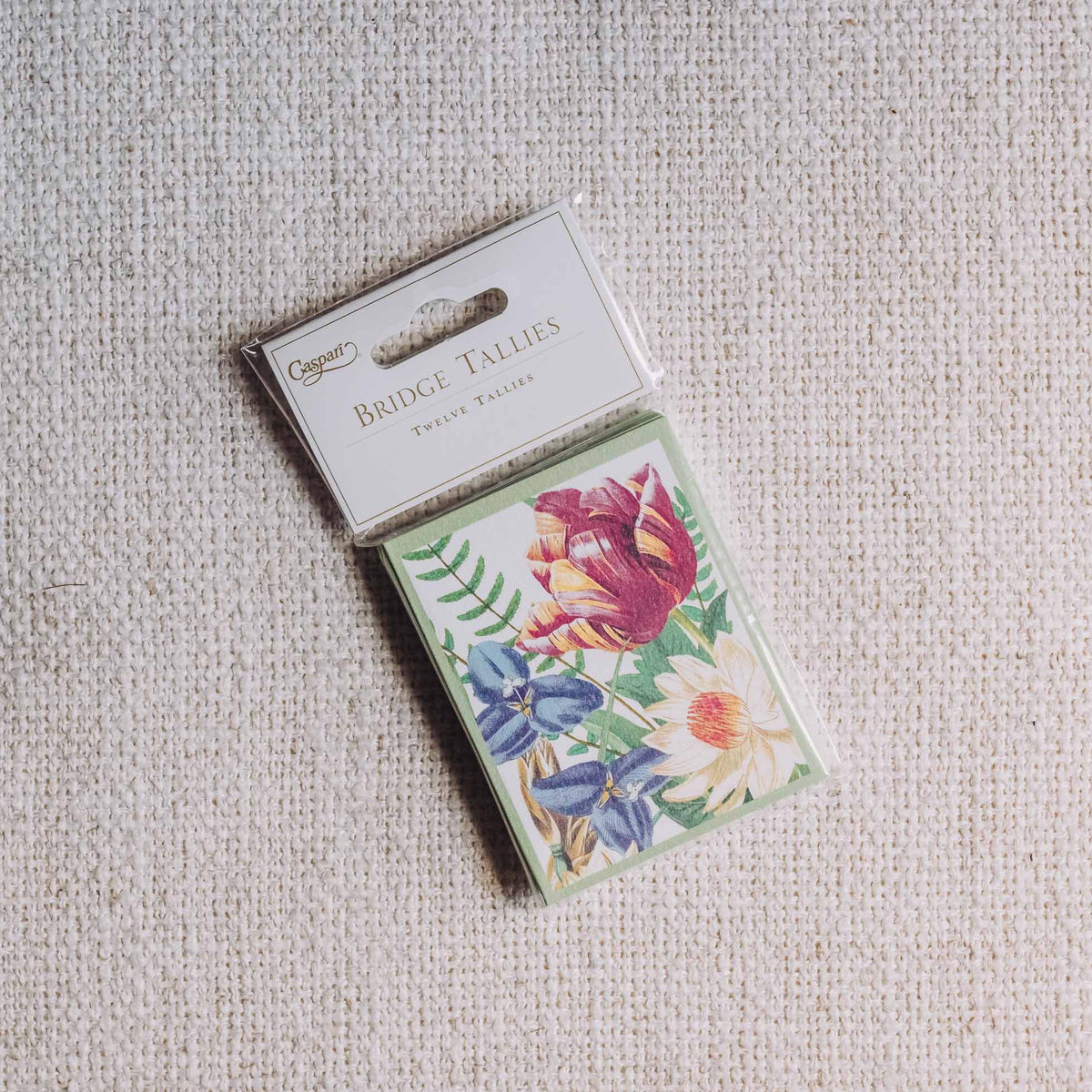 Caspari La Dolce Vita bridge tally sheets featuring watercolor floral design with pink roses and blue delphiniums