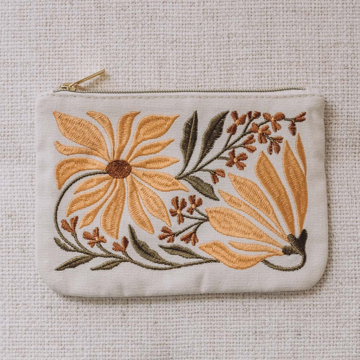 Cream zip pouch with embroidered sunflowers and allium flowers in gold and burgundy tones