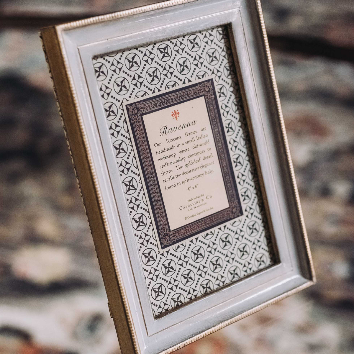 Cream tabletop frame with beaded gold border and decorative patterned mat insert labeled Ravenna