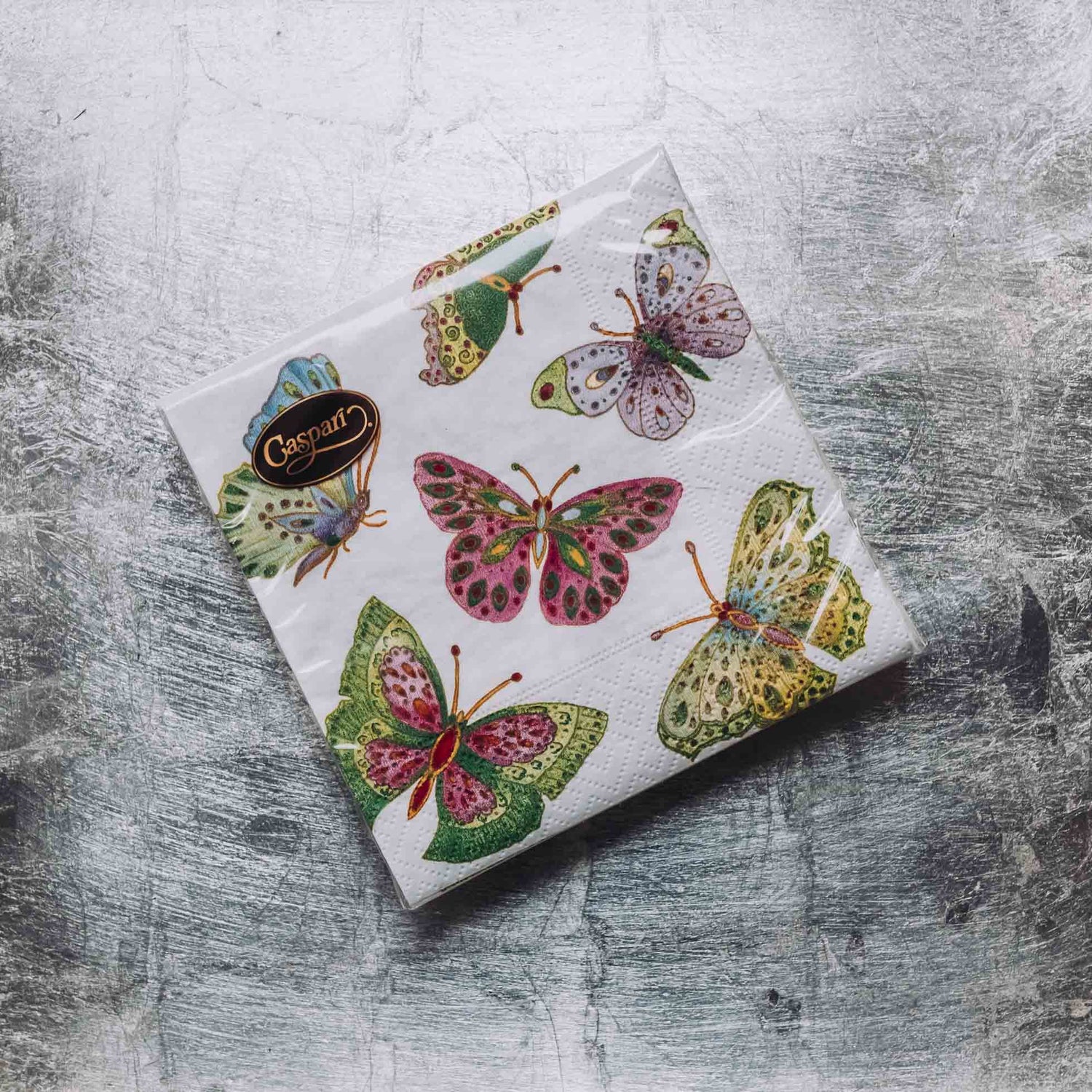 Indulge in luxury with our Caspari triple-ply Cocktail Napkins. Made in Germany, these napkins feature exquisite artwork and designs from around the world, printed with nontoxic, water-soluble dyes and food-safe ink. Elevate your entertaining with sophistication and taste. Comes in sets of 20 napkins in 17 different designs.