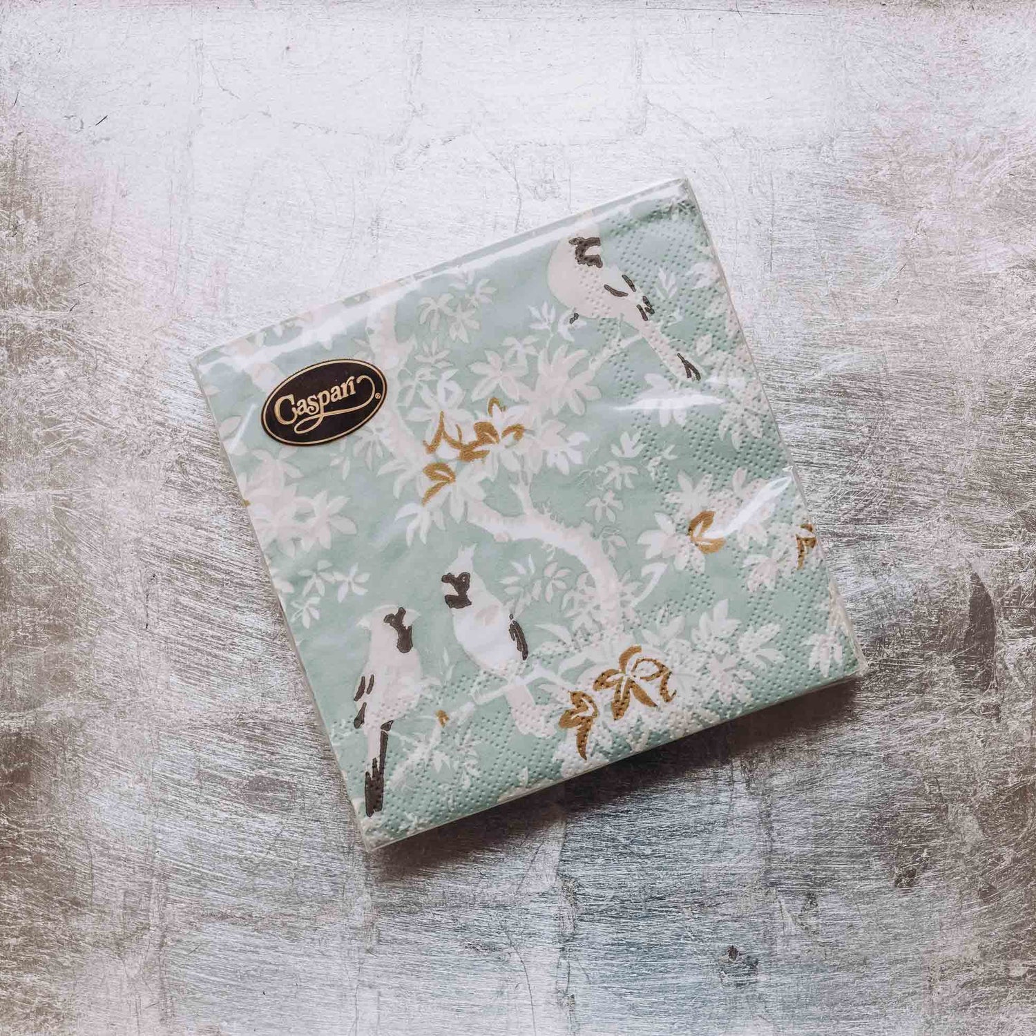 Indulge in luxury with our Caspari triple-ply Cocktail Napkins. Made in Germany, these napkins feature exquisite artwork and designs from around the world, printed with nontoxic, water-soluble dyes and food-safe ink. Elevate your entertaining with sophistication and taste. Comes in sets of 20 napkins in 17 different designs.