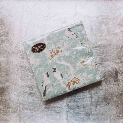 Indulge in luxury with our Caspari triple-ply Cocktail Napkins. Made in Germany, these napkins feature exquisite artwork and designs from around the world, printed with nontoxic, water-soluble dyes and food-safe ink. Elevate your entertaining with sophistication and taste. Comes in sets of 20 napkins in 17 different designs.
