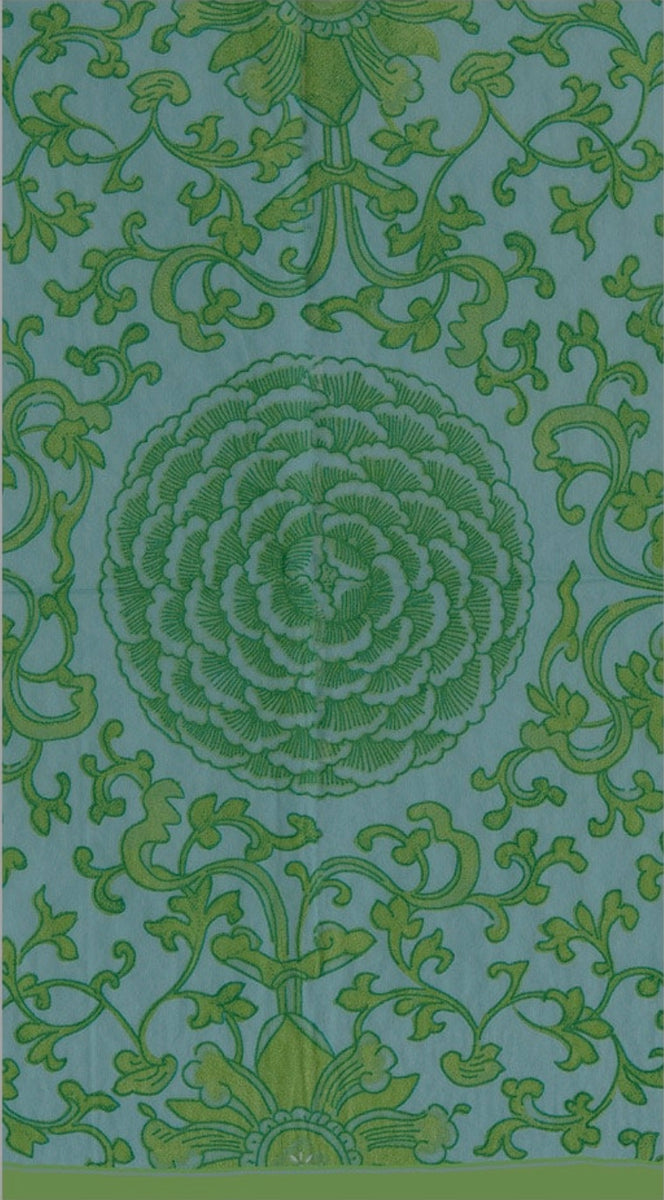 Blue Caspari guest towel with green botanical scrollwork and centered flower medallion design