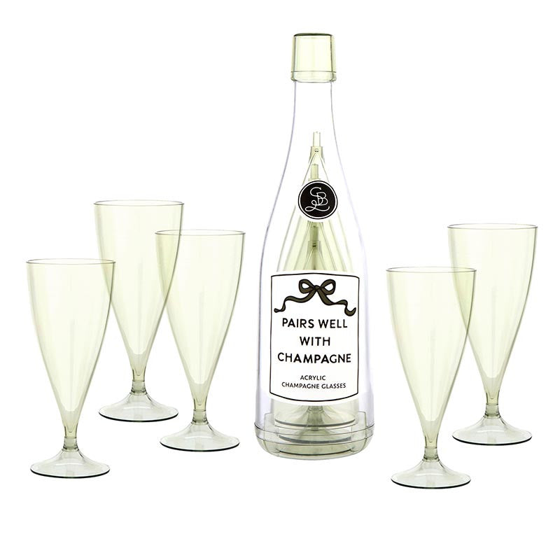 Set of 5 clear acrylic champagne flutes with pedestal stems arranged around a champagne bottle labeled "Pairs Well With Champagne"