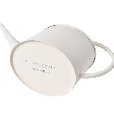 Buttermilk-colored watering can with round body, curved spout, and handle by Burgon & Ball