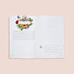 Opened gardening journal showing weekly planner spread with botanical border of red, yellow, and pink flowers and butterflies, plus task checkboxes and notes section