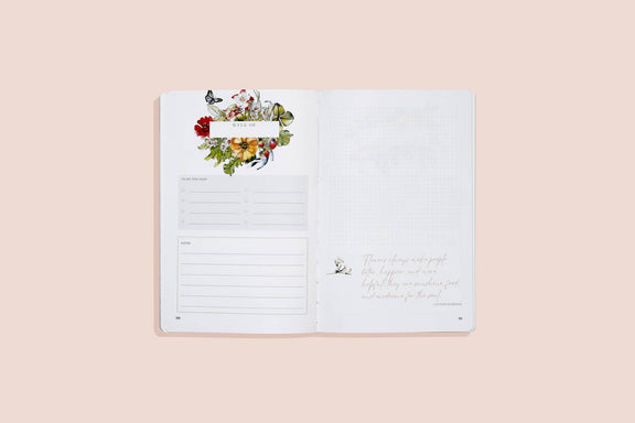 Opened gardening journal showing weekly planner spread with botanical border of red, yellow, and pink flowers and butterflies, plus task checkboxes and notes section