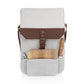 Cream canvas and brown leather wine tote with wooden cutting board and knife in front pocket