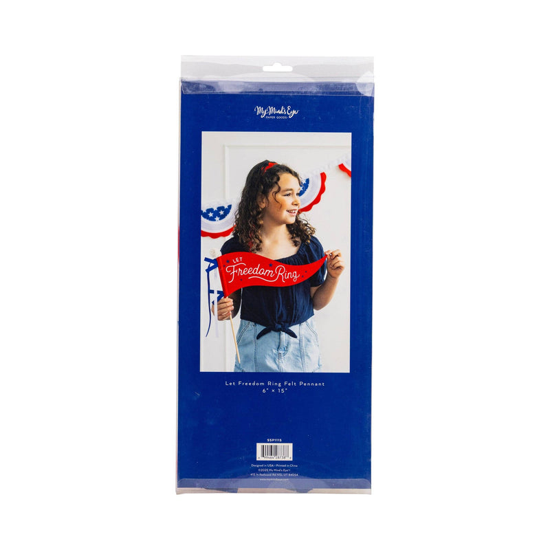 Woman holding red 'Let Freedom Ring' and blue star-patterned felt pennant banners in front of white background, with patriotic ribbon garland