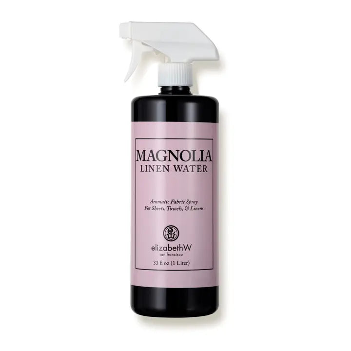 Magnolia Linen Water fabric spray by elizabethW in pink-labeled 33 fl oz bottle with white trigger sprayer and black base.