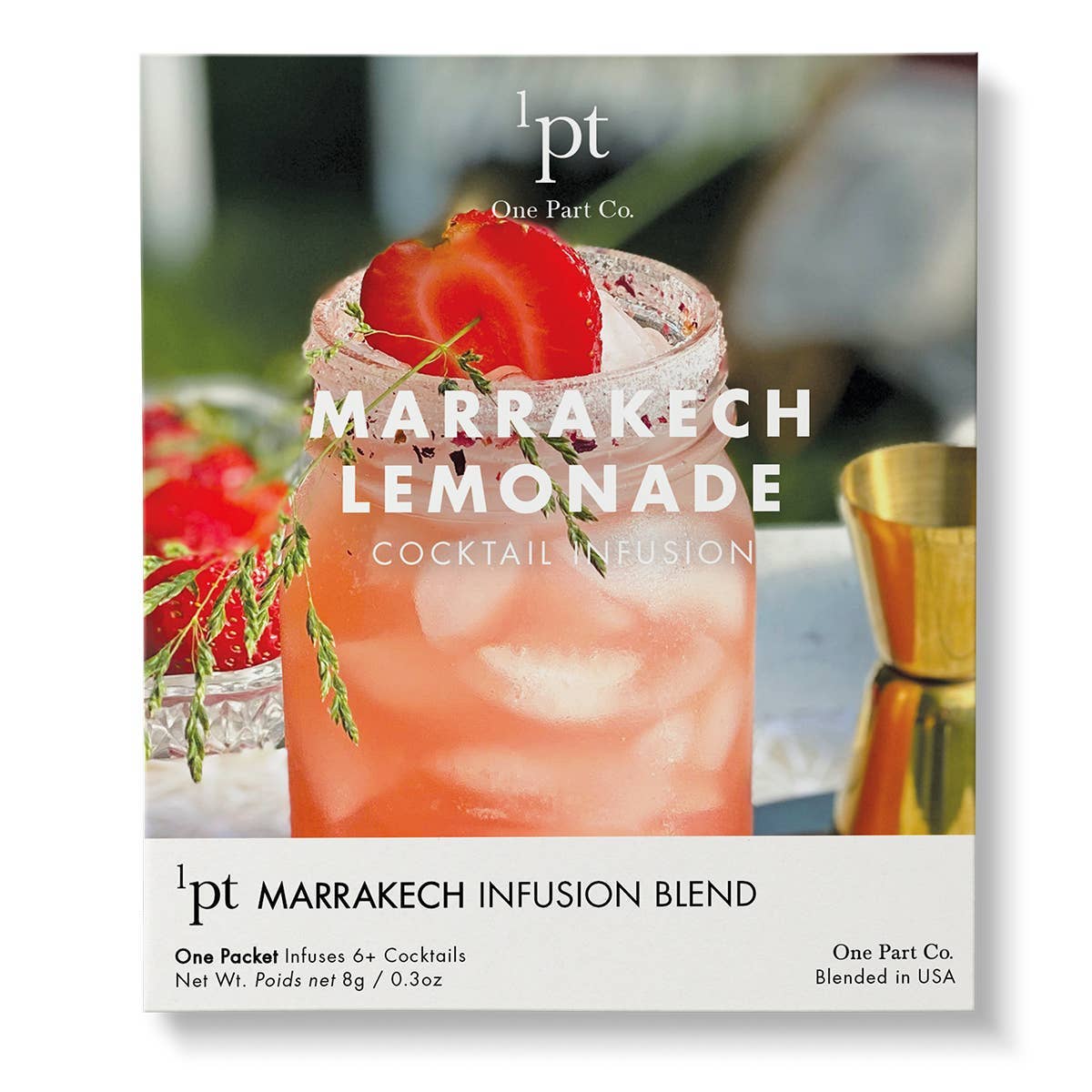 Red strawberry and rosemary-garnished cocktail in glass with ice, showcasing Marrakech Lemonade cocktail infusion mix from One Part Co.