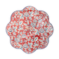 Coral-red paper plate with scalloped edges, white botanical florals and leaves in Americana design