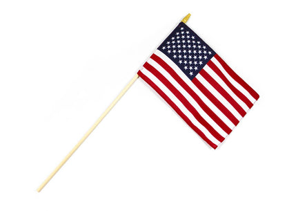 Small American flag with stars on blue canton and red and white stripes mounted on wooden pole