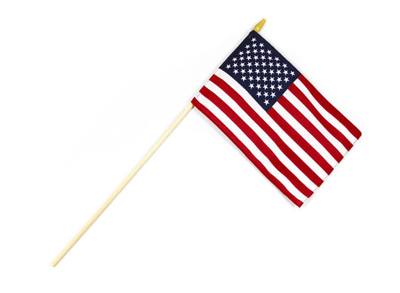 Small American flag with stars on blue canton and red and white stripes mounted on wooden pole