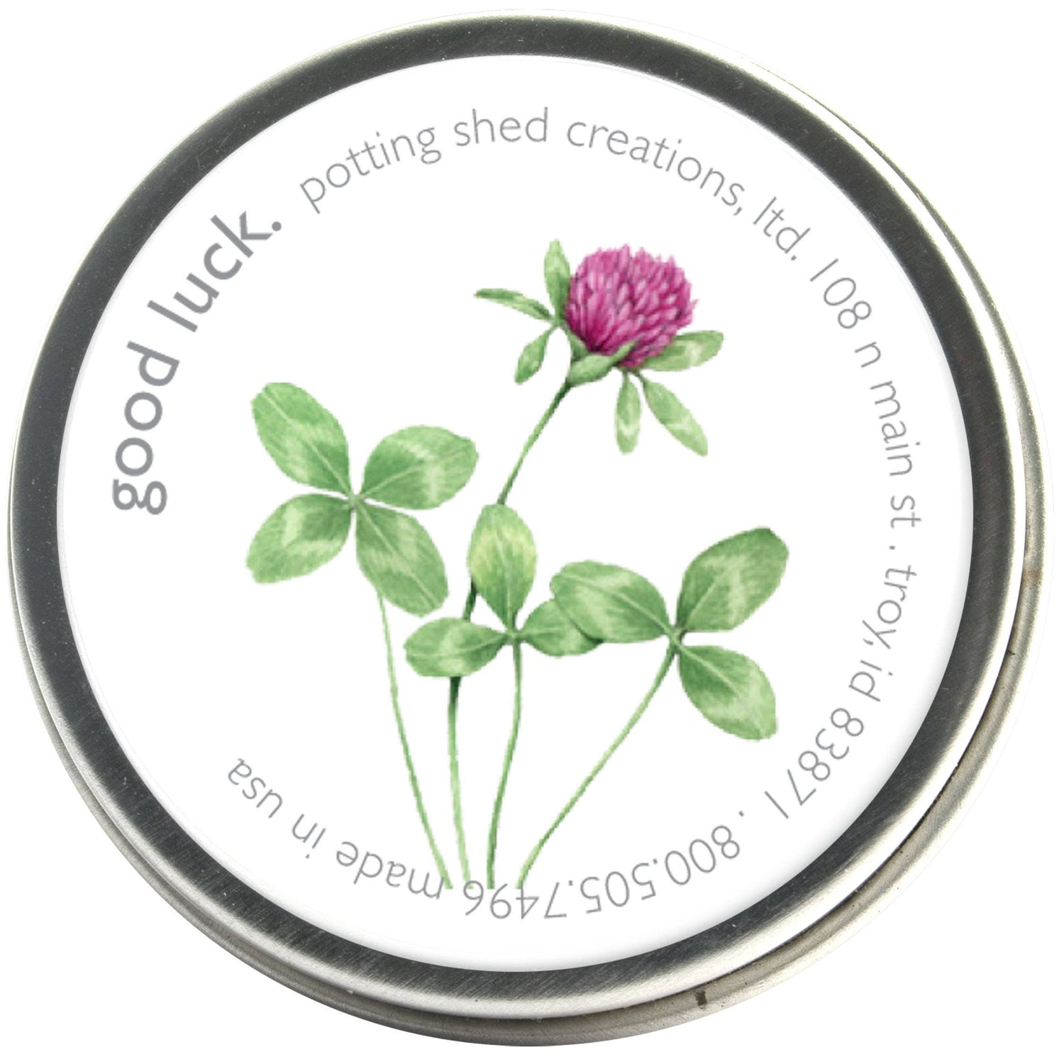Good Luck Clover seed packet with watercolor illustrations of green clover leaves and pink clover bloom on white label