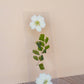 Transparent bookmark featuring white pressed flowers with yellow centers and green foliage