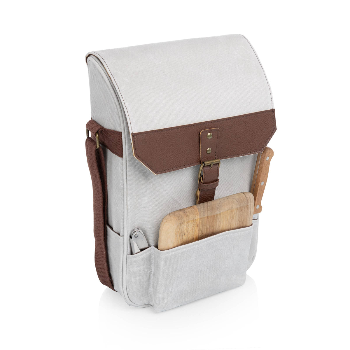 Cream canvas wine tote with brown leather trim, buckle closure, and wooden cutting board with integrated cheese knife set