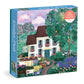 Garden Path 500-piece puzzle box featuring illustrated white cottage surrounded by colorful flowering plants and green foliage.