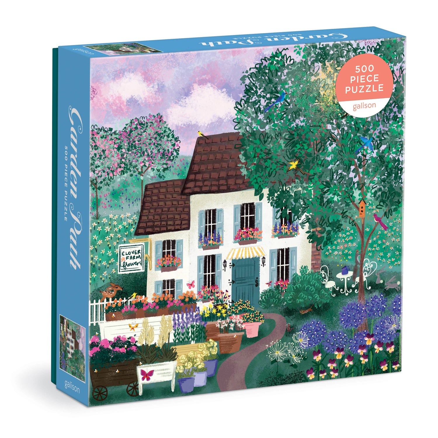 Garden Path 500-piece puzzle box featuring illustrated white cottage surrounded by colorful flowering plants and green foliage.