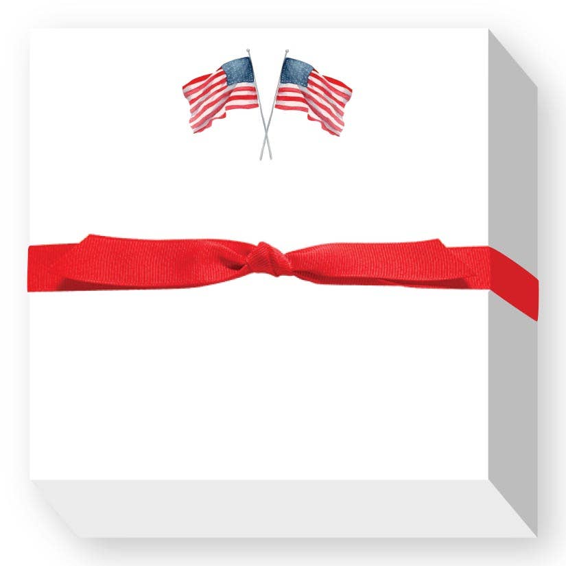White square notepad with red ribbon bow and twin American flags graphic, 5.5x5.5 inch novelty stationery